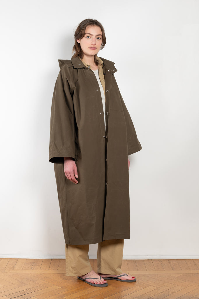 The Parka Coat Oil by Maud Van Den Beussche is a long parka in a structured cotton with detachable hood