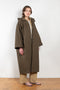 The Parka Coat Oil by Maud Van Den Beussche is a long parka in a structured cotton with detachable hood