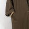 The Parka Coat Oil by Maud Van Den Beussche is a long parka in a structured cotton with detachable hood