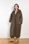 The Parka Coat Oil by Maud Van Den Beussche is a long parka in a structured cotton with detachable hood