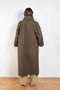 The Parka Coat Oil by Maud Van Den Beussche is a long parka in a structured cotton with detachable hood