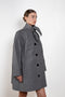 The Bandana Trench by Meryll Rogge is a trench coat crafted in trench cotton, featuring a bandana collar, raglan sleeves and a button closure.
