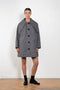 The Bandana Trench by Meryll Rogge is a trench coat crafted in trench cotton, featuring a bandana collar, raglan sleeves and a button closure.