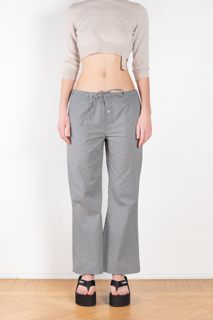 The Checked Pants by Meryll Rogge are low waisted relaxed trousers with a cropped kick flare and drawstring closure