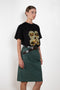 The Chino Pencil Skirt by Meryll Rogge is a unique pencil skirt with a workwear-like silhouette. With XL loop belts and side pockets