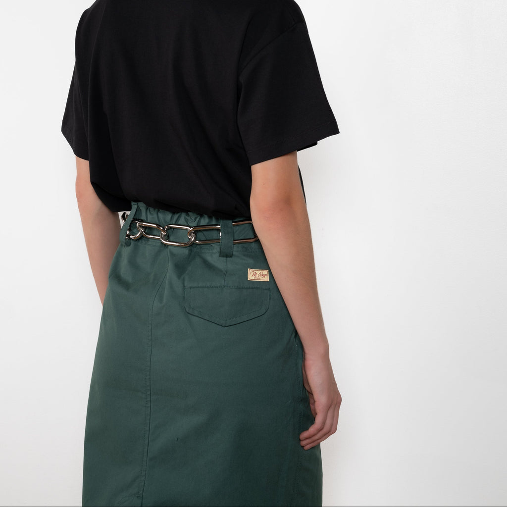 The Chino Pencil Skirt by Meryll Rogge is a unique pencil skirt with a workwear-like silhouette. With XL loop belts and side pockets