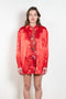 The Classic Shirt by Meryll Rogge is a loose overshirt in a vibrant crinkled red satin fabric