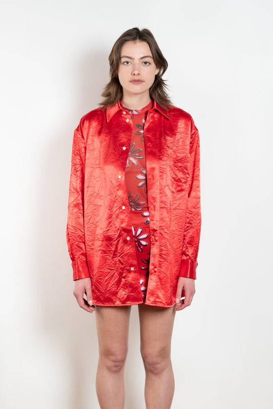 The Classic Shirt by Meryll Rogge is a loose overshirt in a vibrant crinkled red satin fabric