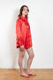 The Classic Shirt by Meryll Rogge is a loose overshirt in a vibrant crinkled red satin fabric