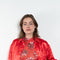 The Classic Shirt by Meryll Rogge is a loose overshirt in a vibrant crinkled red satin fabric