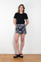 The Daisy Scuba Mini Skirt by Meryll Rogge is a fitted short skirt in a floral embroidery scuba fabric