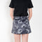 The Daisy Scuba Mini Skirt by Meryll Rogge is a fitted short skirt in a floral embroidery scuba fabric