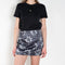 The Daisy Scuba Mini Skirt by Meryll Rogge is a fitted short skirt in a floral embroidery scuba fabric