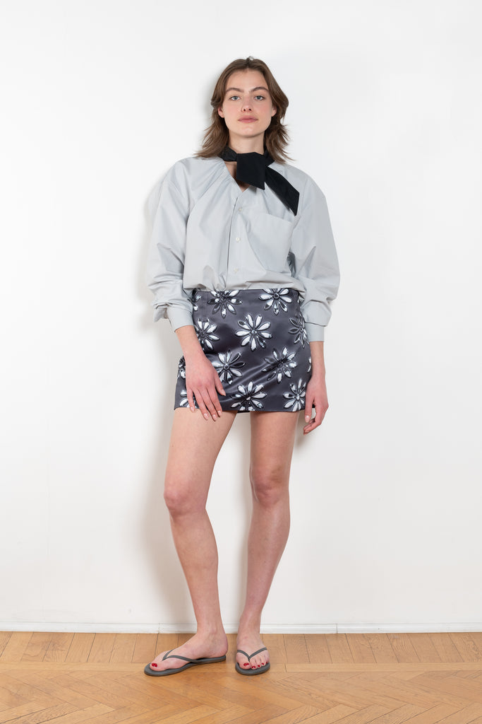 The Daisy Scuba Mini Skirt by Meryll Rogge is a fitted short skirt in a floral embroidery scuba fabric