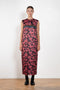 The Long Shift Dress by Meryll Rogge is a sleeveless shift dress crafted in floral scuba satin, featuring a round neckline and a contrasting ribbon detail.