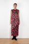 The Long Shift Dress by Meryll Rogge is a sleeveless shift dress crafted in floral scuba satin, featuring a round neckline and a contrasting ribbon detail.