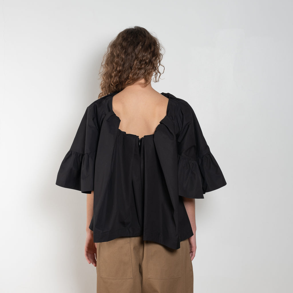 The Ruffled Back Drape Top by Meryll Rogge is a crisp cotton top with an open back and a back draped detail