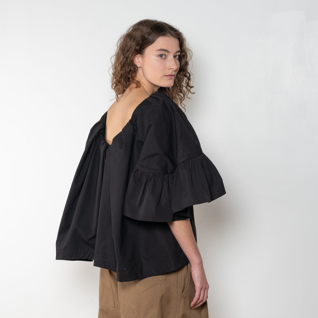 The Ruffled Back Drape Top by Meryll Rogge is a crisp cotton top with an open back and a back draped detail