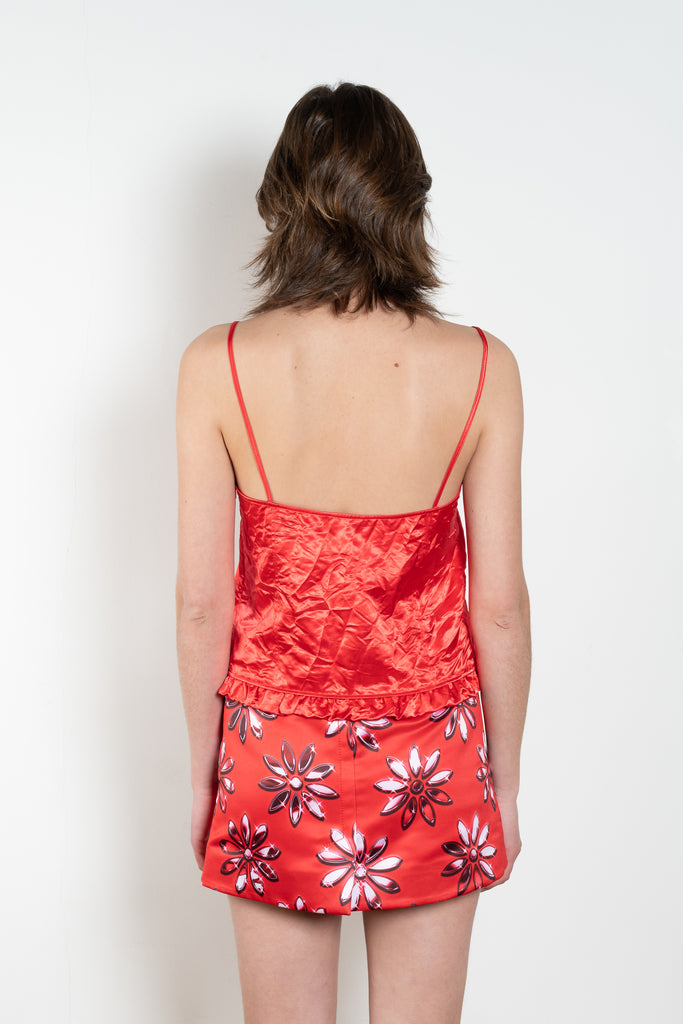 The Ruffle Slip Top by Meryll Rogge is a delicate top with a sweetheart neckline, fine straps and a ruffle hem