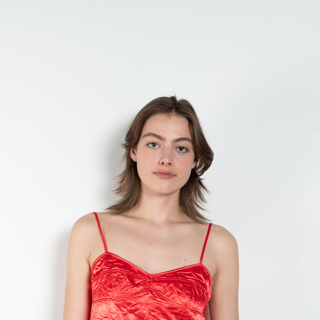 The Ruffle Slip Top by Meryll Rogge is a delicate top with a sweetheart neckline, fine straps and a ruffle hem