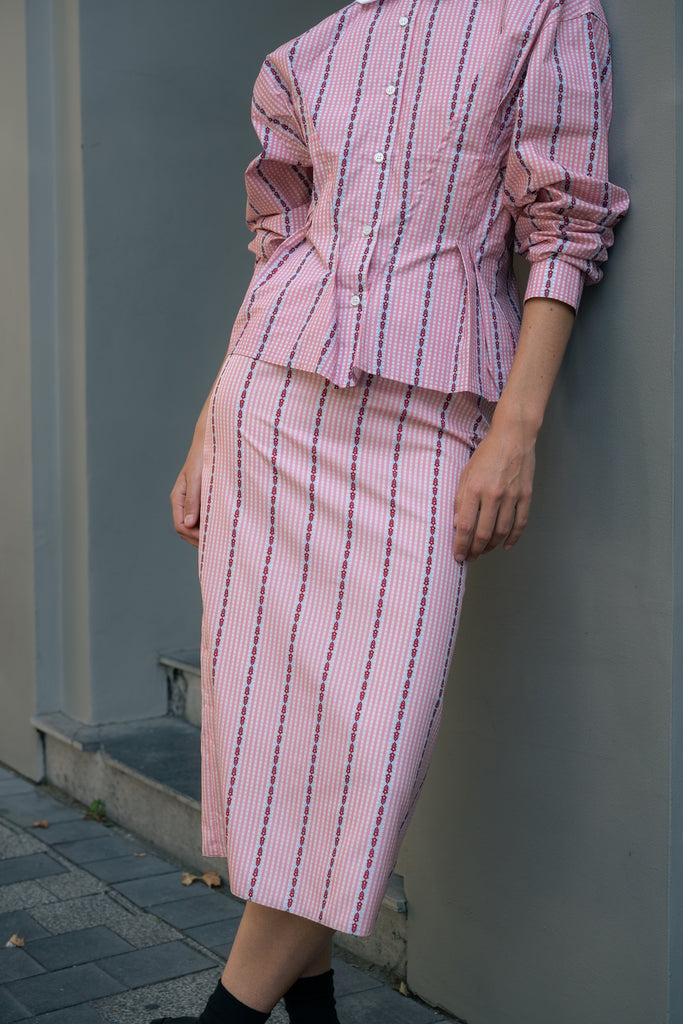 The Slip Skirt by Meryll Rogge is crafted in striped nylon silk, featuring a midi length and a straight silhouette.