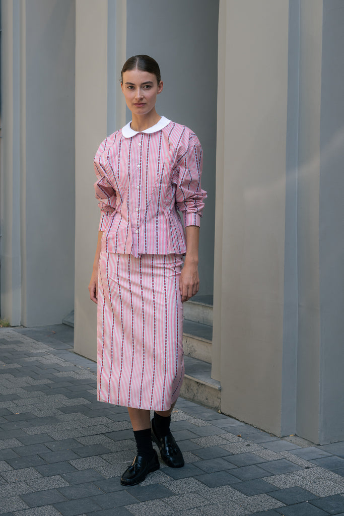 The Slip Skirt by Meryll Rogge is crafted in striped nylon silk, featuring a midi length and a straight silhouette.