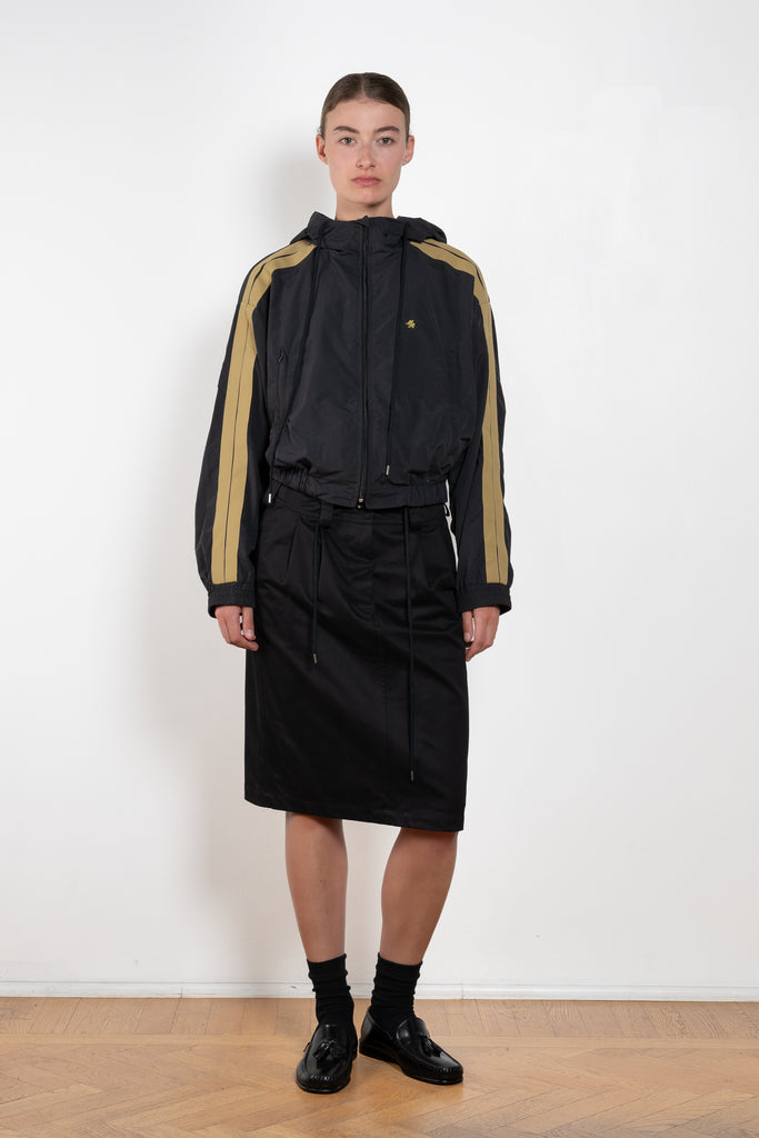 The Sporty Jacket by Meryll Rogge crafted in nylon, featuring a hood, contrast stripe panels, drawstring details and a zip closure