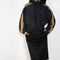 The Sporty Jacket by Meryll Rogge crafted in nylon, featuring a hood, contrast stripe panels, drawstring details and a zip closure