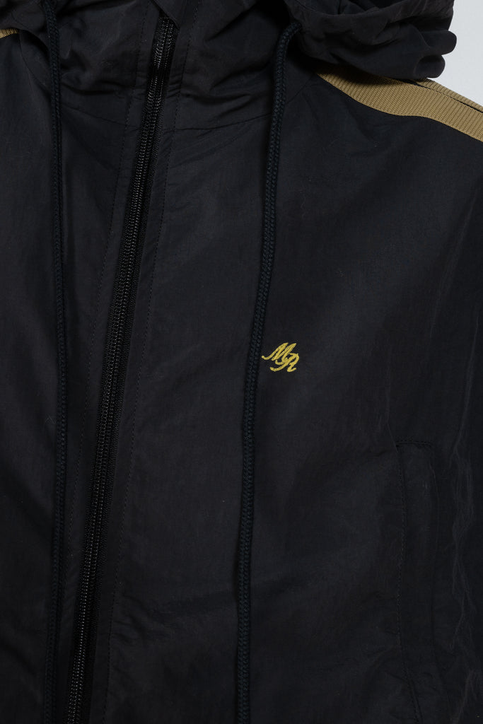 The Sporty Jacket by Meryll Rogge crafted in nylon, featuring a hood, contrast stripe panels, drawstring details and a zip closure