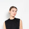 The Tuxedo Top by Meryll Rogge is structured sleeveless top with button detailing on the back and a tuxed band