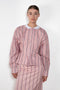 The Waisted Shirt by Meryll Rogge is a long-sleeved waisted shirt crafted in printed cotton, featuring a club collar and a fitted silhouette.