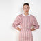 The Waisted Shirt by Meryll Rogge is a long-sleeved waisted shirt crafted in printed cotton, featuring a club collar and a fitted silhouette.