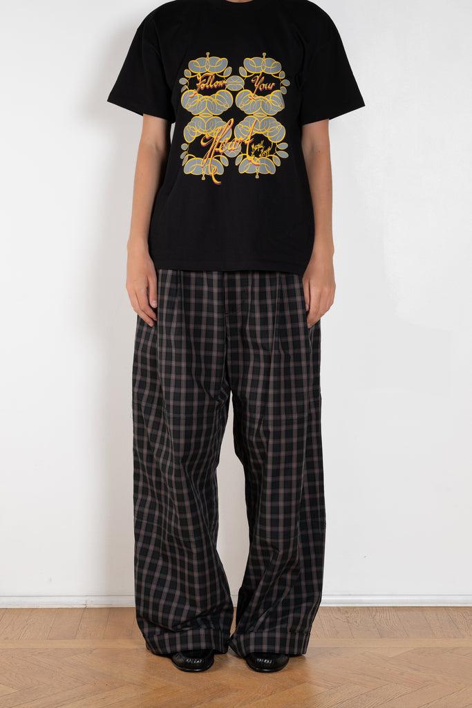 The Workwear Drawstring Chino by Meryll Rogge crafted in grey/black/red checked cotton, featuring a wide-leg silhouette and turned-up hems.