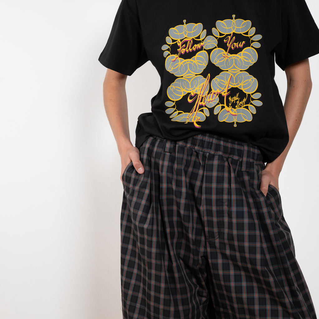 The Workwear Drawstring Chino by Meryll Rogge crafted in grey/black/red checked cotton, featuring a wide-leg silhouette and turned-up hems.
