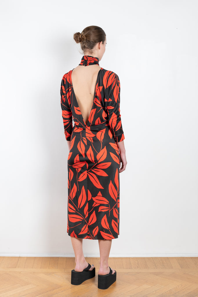 The Printed Dress by Meryll Rogge is a long sleeve dress with a sensual deep V open back in a soft and flowy viscose leaf print