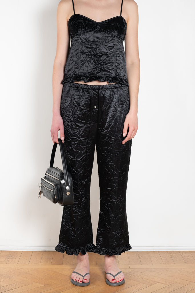 The Ruffle Pant by Meryll Rogge is a low waist trouser wit a drawstring closure and a ruffle hem