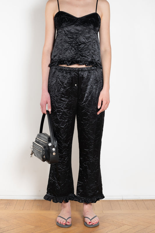 The Ruffle Pant by Meryll Rogge is a low waist trouser wit a drawstring closure and a ruffle hem