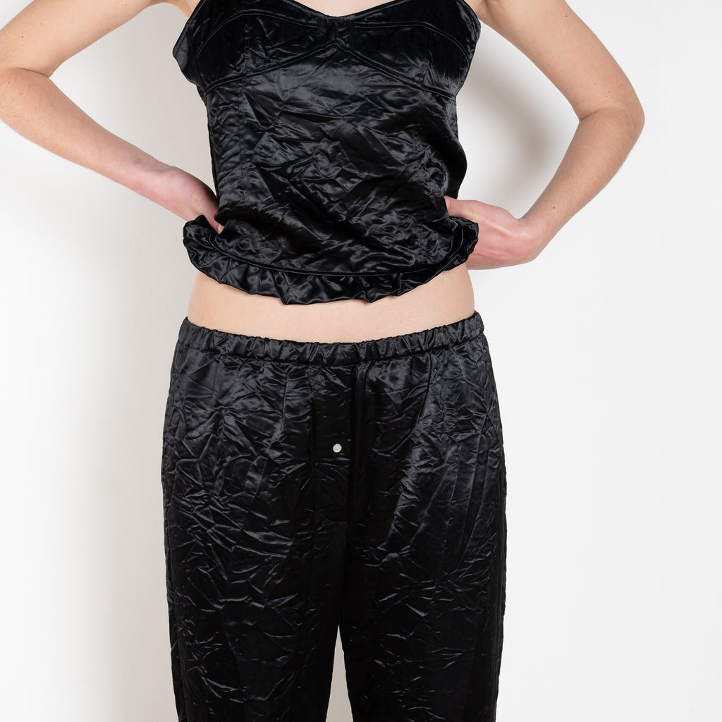 The Ruffle Pant by Meryll Rogge is a low waist trouser wit a drawstring closure and a ruffle hem
