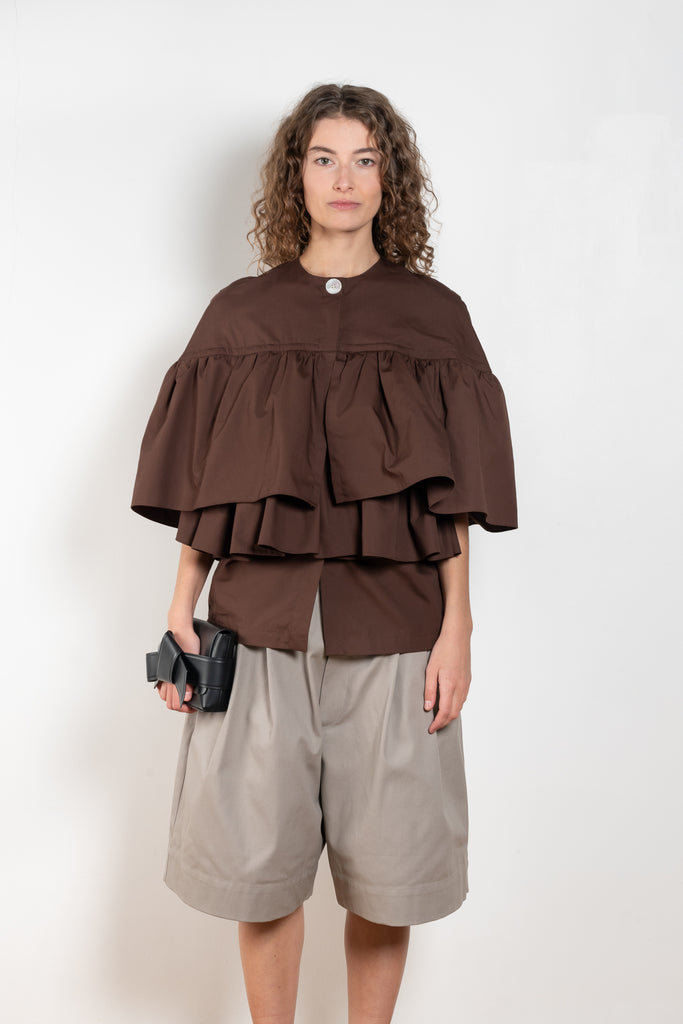 The Ruffle Tiered Top by Meryll Rogge is a crisp cotton top with layered ruffles that can be tucked into your trousers