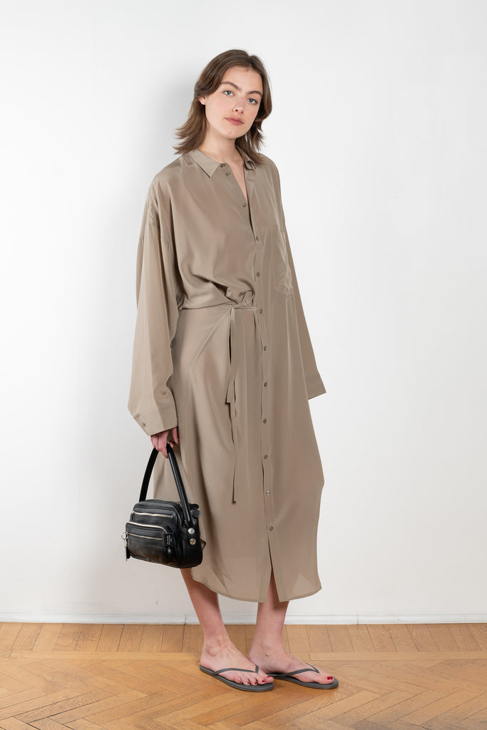 The 10.4 Dress by Monique Van Heist is a loose silk dress that can be tied at the waist