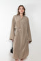 The 10.4 Dress by Monique Van Heist is a loose silk dress that can be tied at the waist