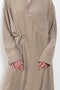 The 10.4 Dress by Monique Van Heist is a loose silk dress that can be tied at the waist