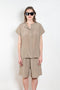 The Lily Top by Monique Van Heist is a short sleeved silk top with a buttoned mao collar