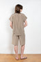 The Lily Top by Monique Van Heist is a short sleeved silk top with a buttoned mao collar
