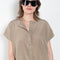 The Lily Top by Monique Van Heist is a short sleeved silk top with a buttoned mao collar