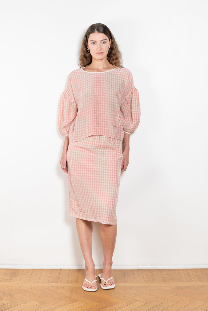The Crayon Skirt by Nackiye is a knee length pencil skirt with loops. Gathered at the waist with a revealing petticoat