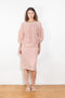 The Crayon Skirt by Nackiye is a knee length pencil skirt with loops. Gathered at the waist with a revealing petticoat