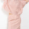 The Crayon Skirt by Nackiye is a knee length pencil skirt with loops. Gathered at the waist with a revealing petticoat