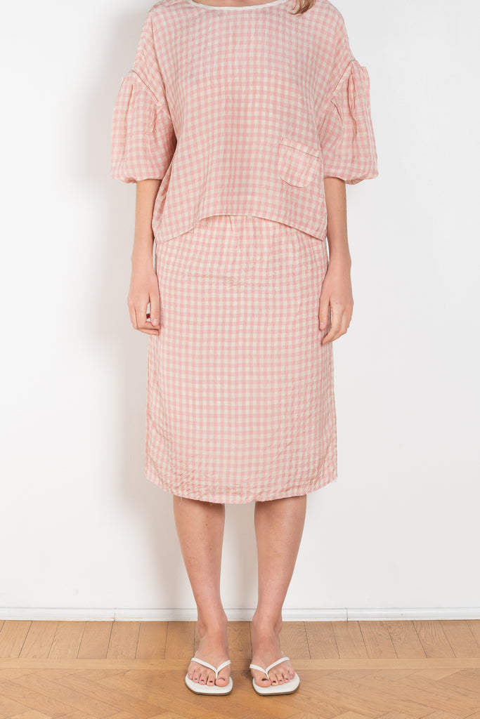 The Crayon Skirt by Nackiye is a knee length pencil skirt with loops. Gathered at the waist with a revealing petticoat