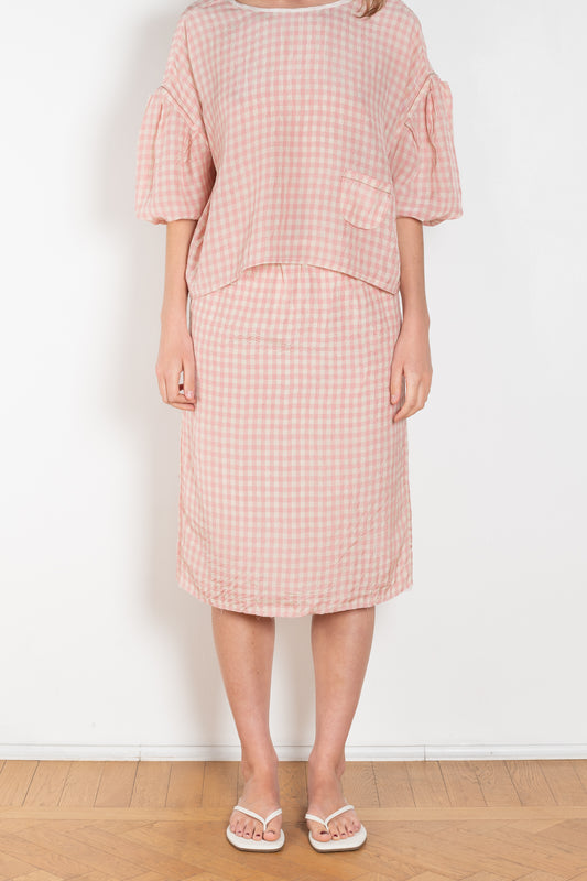 The Crayon Skirt by Nackiye is a knee length pencil skirt with loops. Gathered at the waist with a revealing petticoat